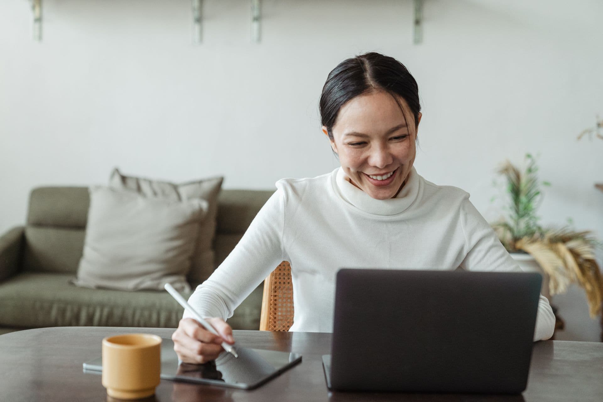 Professional smiling while joining a virtual training session from home
