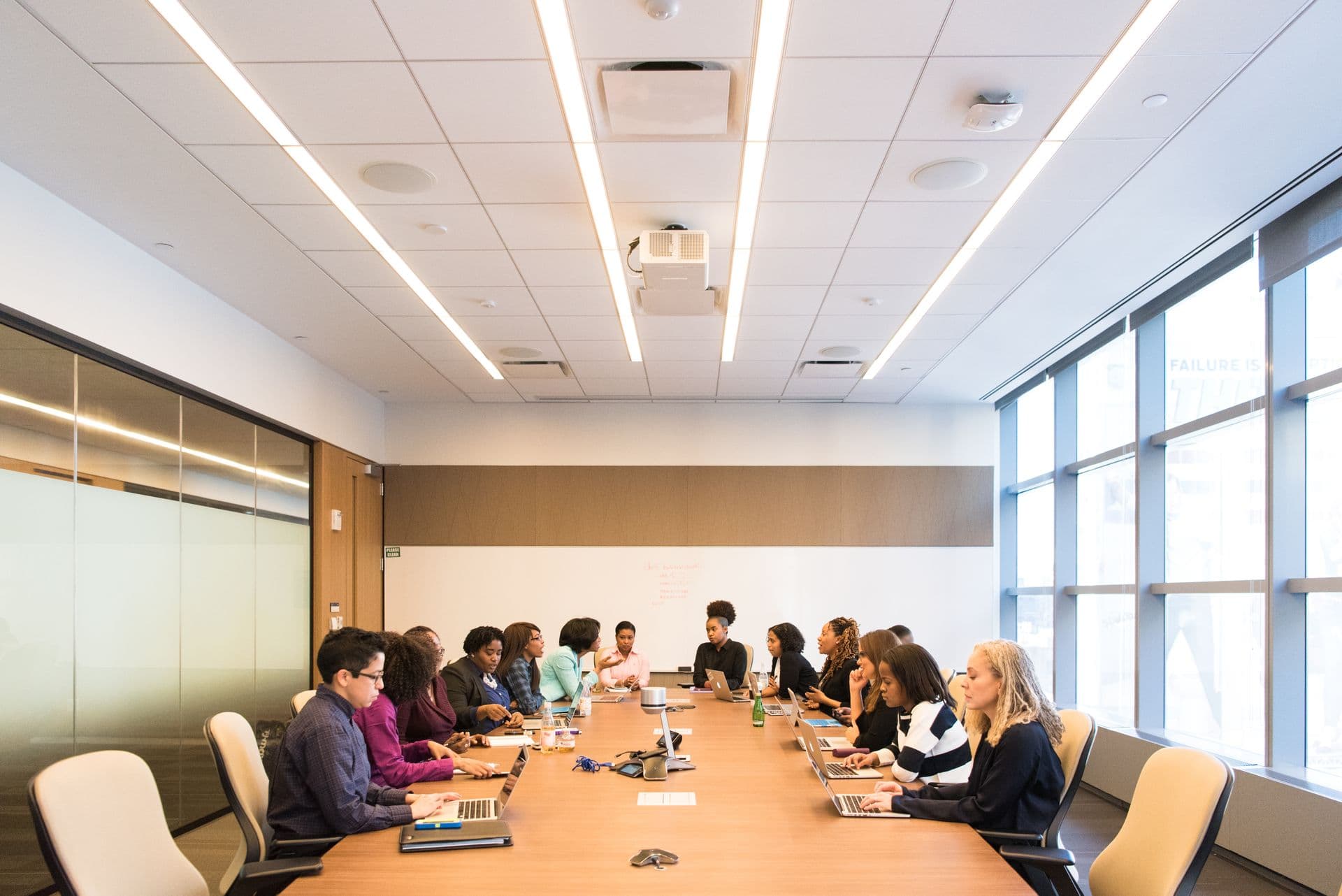 Diverse enterprise team collaborating in a modern conference room